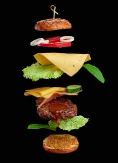 悬浮芝士汉堡成分多汁的肉肉片切达干酪