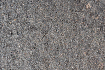 灰色的粗糙的<strong>火山石头</strong>表面详细的自然背景纹理