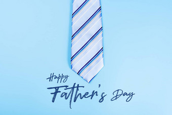 快乐父亲一天背景概念蓝色的领带蓝色的背景复制空间文本