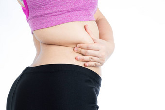 脂肪女人持有过度脂肪肚子较低的回来超重高脂肪的肚子孤立的白色背景饮食生活方式重量损失胃肌肉健康的概念