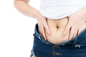 脂肪女人持有过度脂肪肚子超重高脂肪的肚子孤立的白色背景饮食生活方式重量损失胃肌肉健康的概念
