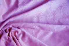 纹理粉红色的纺织材料褶皱背景
