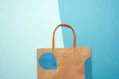 棕色（的）纸袋处理购物蓝色的背景