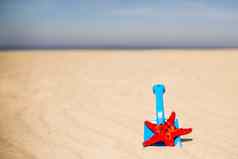海滩孩子玩具铲桶红色的海明星