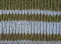 橄榄绿色羊毛手针织纹理光蓝色的条纹摘要背景