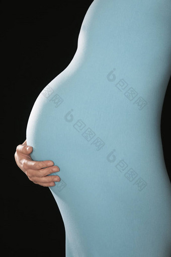 怀孕了女人身体西装持有腹部中期部分一边视图工作室拍摄