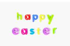 色彩斑斓的字母磁铁拼写“快乐复活节的白色背景