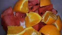 特写镜头视图混合水果片柑橘类橙子甜蜜的红色的西瓜