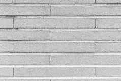 灰色的狭窄的块模仿砖墙水平叠加