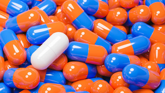 关闭白色药丸胶囊橙色蓝色的药片胶囊医学专业药品概念模型插图