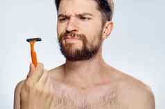 男人。剃须刀手胡子面部皮肤护理早....生活方式清洁皮肤