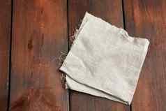 灰色的厨房纺织毛巾折叠棕色（的）木表格