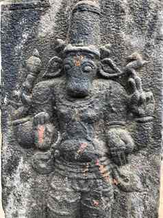 神小腿头雕塑巴斯救援雕塑雕刻石头墙湿婆寺庙泰米尔Nadu