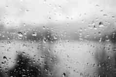 雨滴窗口说明灰色的多雨的天气一天黑色的白色灰度