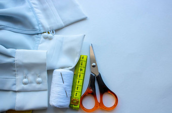 织物缝纫衣服项目缝纫衣服厘米磁带裁剪剪刀线程拉链蓝色的织物缝纫衣服