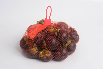 山竹果水果网袋公斤白色背景著名的水果泰国