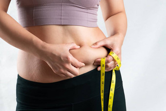 脂肪女人脂肪肚子胖乎乎的肥胖女人手持有过度
