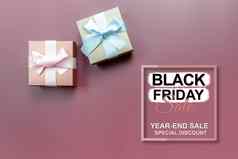 黑色的星期五出售礼物盒子粉红色的背景特殊的一天
