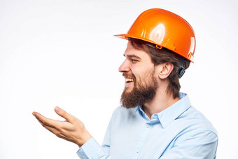 男人。橙色头盔衬衫建设工程师行业工作