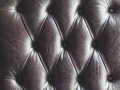 皮革沙发capitone切斯特菲尔德技术家具室内装潢黑暗优雅的家具阁楼织物背景自然变形背景
