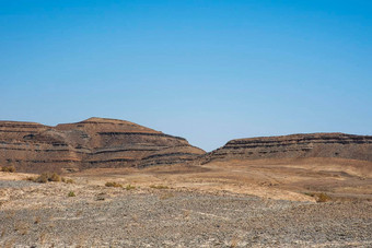 视图火山口雷蒙火山口干旱沙漠视图白色金沙地平线蓝色的天空内盖夫以色列