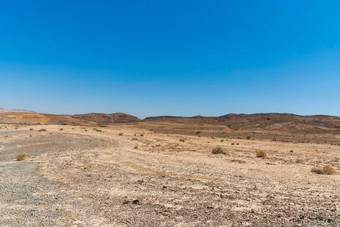 视图火山口雷蒙火山口干旱沙漠视图白色金沙地平线蓝色的天空内盖夫以色列