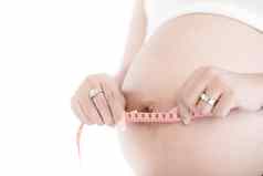 怀孕了女人测量肚子测量磁带