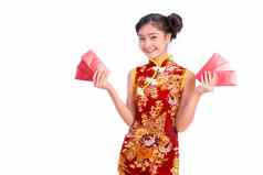 年轻的亚洲美女人穿旗袍携带红色的包钱中国人一年节日事件孤立的白色背景假期生活方式概念旗袍衣服穿