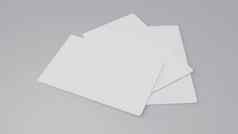 白色礼物卡信贷卡模型叠加灰色表格背景对象背景业务品牌演讲模板打印英寸纸大小封面插图呈现