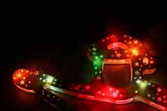 美丽的摘要色彩斑斓的背景圣诞节发光的冬天装饰黑色的木背景雪人圣诞老人手套