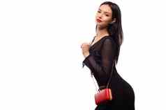 庆祝活动迪斯科晚上时尚概念女人黑色的衣服持有红色的手提包钱包