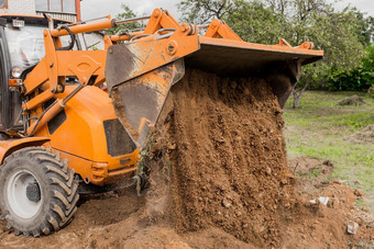 桶推土机填满沟地球工业区挖掘建设作品