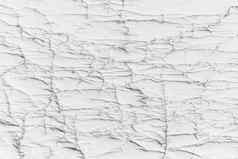 白色表面裂缝墙损坏的纹理光背景