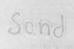 词沙子写白色海滩沙子背景标志象征沙子概念
