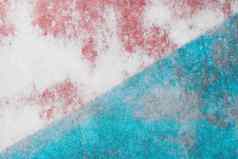 白色混凝土墙纹理摘要模具模式对角行蓝色的红色的油漆背景