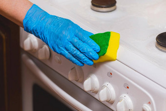 手女人家庭主妇家庭手套海绵气体炉子控制面板国内清洁厨房