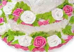 特写镜头白色奶油蛋糕启发白色粉红色的玫瑰绿色叶子