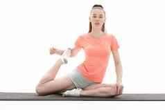 实践瑜伽年轻的女人体育服装培训瑜伽位置