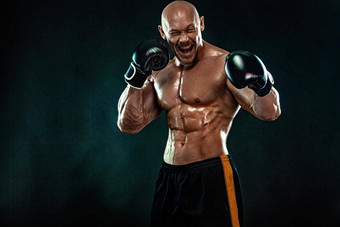运动员男人。拳击手战斗手套黑色的背景健身拳击概念行动拍摄个人体育娱乐