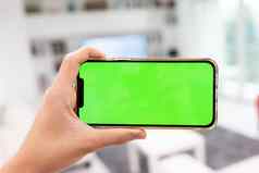 手现代生活房间聪明的首页移动电话空白绿色屏幕