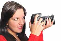 年轻的女人持有相机手采取图片孤立的