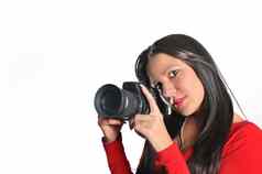 年轻的女人持有相机手采取图片孤立的