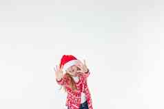 肖像快乐女孩跳舞穿红色的圣诞节毛衣圣诞老人他孤立的白色背景年轻的高加索人快乐的微笑金发女郎女孩圣诞节红色的鹿毛衣快乐