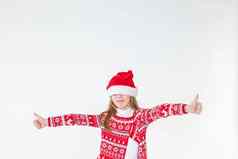 肖像快乐女孩跳舞穿红色的圣诞节毛衣圣诞老人他孤立的白色背景年轻的高加索人快乐的微笑金发女郎女孩圣诞节红色的鹿毛衣快乐