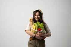 女人持有棉花杂货店袋蔬菜绿色可重用的生态袋购物浪费概念可持续发展的生活方式生态友好的概念