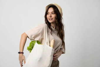 女人持有纺织杂货店袋蔬菜浪费概念package-free食物购物生态友好的自然袋<strong>有机</strong>水果蔬菜