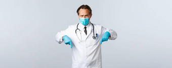 科维德防止病毒医疗保健工人疫苗接种概念确定医生显示措施冠状病毒穿医疗面具手套指出手指