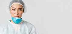 科维德冠状病毒疾病医疗保健工人概念特写镜头累了疲惫亚洲女医生起飞呼吸器保护眼镜护士皮肤损害转变医院