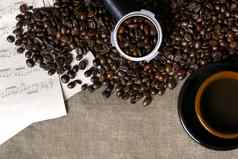 咖啡豆子表音乐咖啡杯粗麻布背景