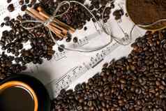 咖啡豆子地面咖啡杯酿造咖啡表音乐背景视图空间文本